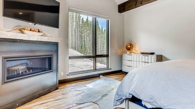 Primary suite with fireplace on upper level