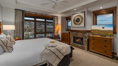 Primary king bedroom with fireplace