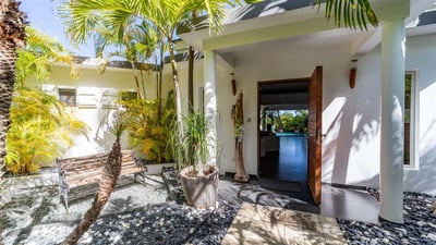 Outdoors: Private parking at the entrance of the property. 