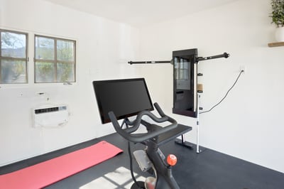 Peloton Bike and a Tonal Home Gym.