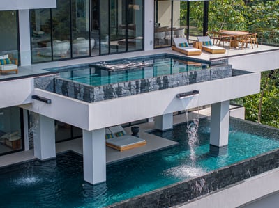 Second roofed pool with waterfall