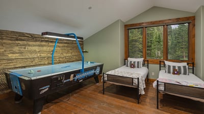 Twin x4 bedroom with air hockey table; upper loft