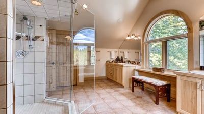 Primary ensuite with dual vanities and large walk in shower