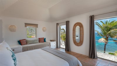 Bedroom 3: Located in separate cottage, on an upper level. A king size bed, air conditioning,HD-TV, 