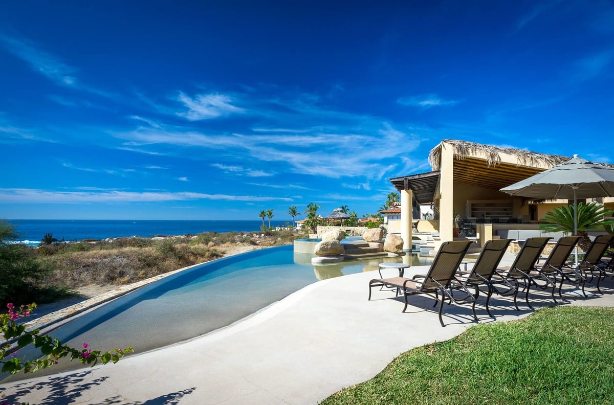 Relax & unwind along the terrace on one of the many lounge chairs and soak up the warm Cabo sun! - Image 1