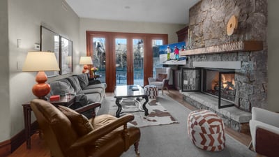 Hearth room with access to the front deck and firepit