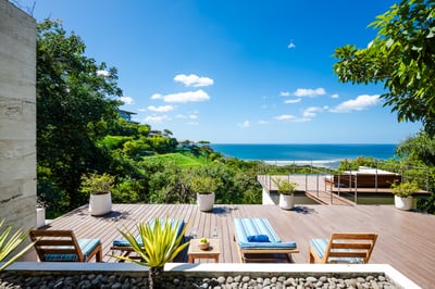 Tan, have a drink while watching the ocean