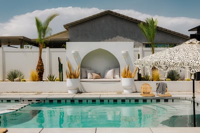 Dive into the shimmering saltwater pool with a baja shelf or unwind in the adjacent spa, perfect for