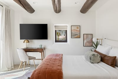 Living Desert: King bed, writing desk, armoire and en suite bathroom with shower and tub.