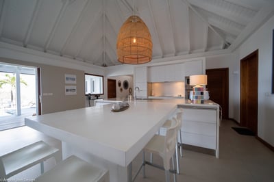 Kitchen & Dining Area: Ocean view and green hills. The kitchen is open and modern then well equipped