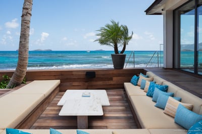 Outdoor Lounge: Outside lounge area next to the pool, facing the beach.