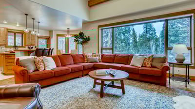 Great room with large couch and views