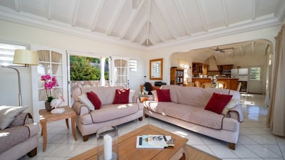 Living Area: Open-air living room, TV, DVD player,Large sofas,Dish Network, French satellite, phone,