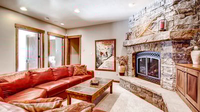 Lower level family room with TV, fireplace