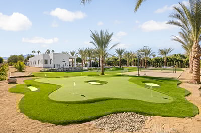 Work on your swing over at the putting green complete with sand traps!