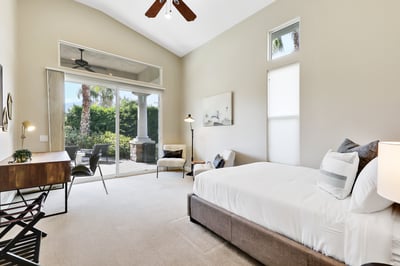 Guest bedroom 4- Queen bed with sitting area and writing desk. Direct access to patio.