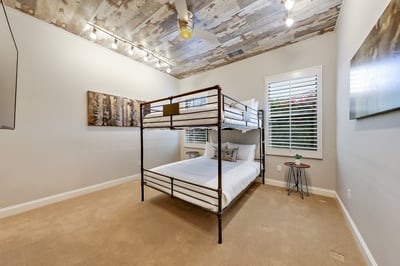 Guest bedroom 2- Full-size bunk beds. Sleeps 4. Includes walk-in closet, Smart TV and en suite bathr