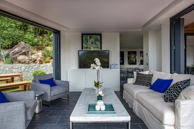 Living Area: Located on the first floor. Air-conditioned, it opens onto the poolside