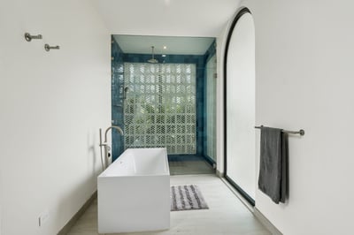 - Indulge in a relaxing soak in the sleek freestanding tub with modern fixtures
- Refresh in a large