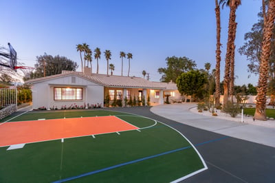 Shoot some hoops on the half basketball court at the front of the house.