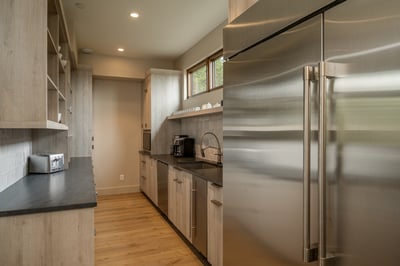 Large chef's pantry behind kitchen
