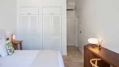 Bedroom 2: Located next to the living room. Air conditioning, fan, queen size bed, desk with chairs 