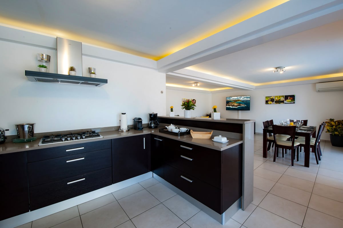 Kitchen & Dining Area: Fully equipped air-conditioned kitchen with electric oven, induction cooker,  - Image 18