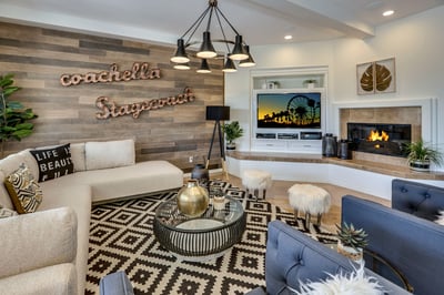 Living room furnished with large HDTV and fireplace