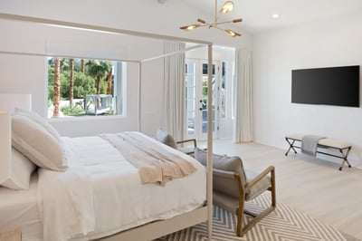 This room also has a large Smart TV and patio with access to both pools and steps from a cushioned s