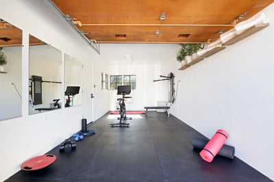 Peloton Bike and a Tonal Home Gym.