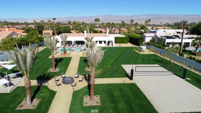 Expansive 1.0 acre yard with resort-style amenities: large pool/spa, sand volleyball, putting green,