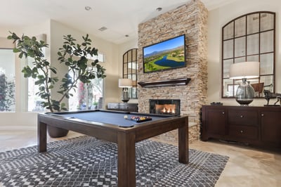 Game room with wet bar, big screen TV and fireplace