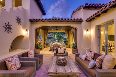 Nighttime private courtyard with comfy seating