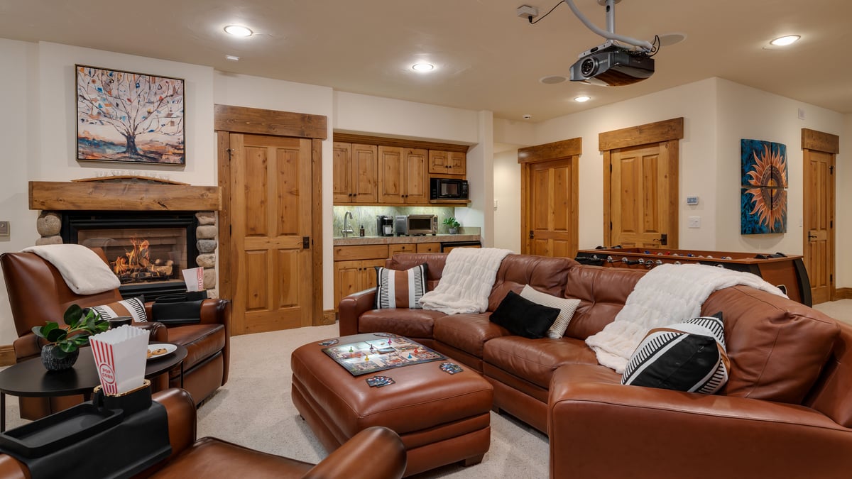 Family Room on Lower level with fireplace and wet bar - Image 17