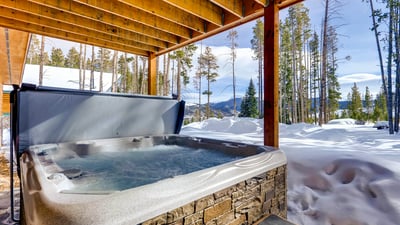Soak away your sore muscles in this private hot tub after a day on the mountain