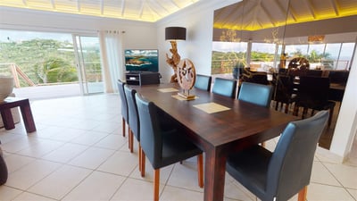 Dining Areas: Indoor dining area next to the living room with the table for 8 guests. Outdoor dining