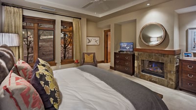 Primary suite with fireplace and TV