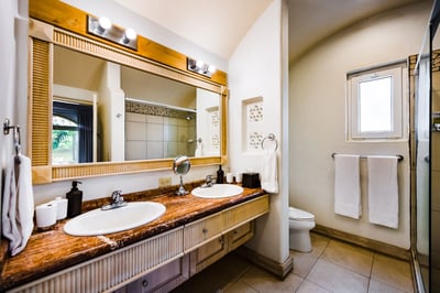 #3 Master suite – His and Hers double sink bathroom, each with its own side, and a bath tub.
