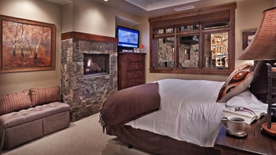 Primary bedroom suite with king bed, fireplace and ensuite