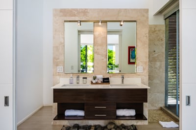 #1. His and Hers double sink bathroom, each with its own side, and a spacious, modern shower