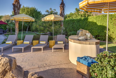 4 comfortable lounge chairs and umbrellas for shade