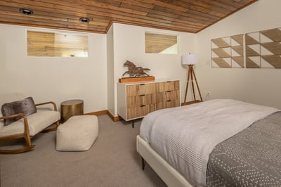 Sink into your private retreat with warm wood ceilings, plush seating, and thoughtful design touches