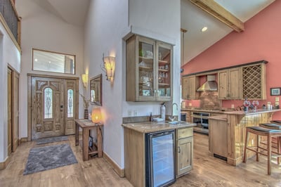 Entryway, wet bar and kitchen