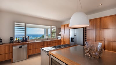 Kitchen & Dining Area: Fully equipped gourmet kitchen with gas oven and two stoves with grill and gr