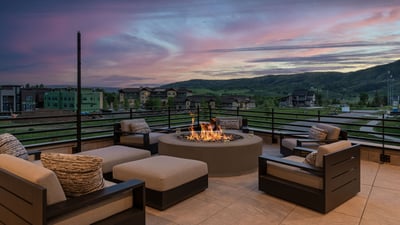 Main level deck with gas fireplace and comfortable seating
