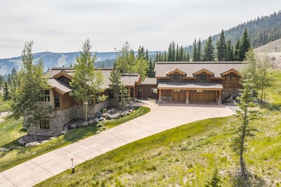A stunning mountain retreat set among aspen and evergreen trees, with expansive views.