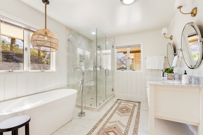 Primary en suite with double vanities, walk in shower and soaking tub