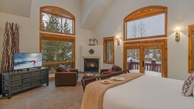 Primary king suite on main level with fireplace