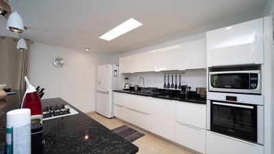 Kitchen: Air-conditioned kitchen equipped with electric oven, gas stove, microwave, fridge and freez