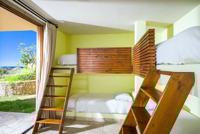 Floor-to-ceiling windows area featured throughout the villa, including in all the bedrooms!
